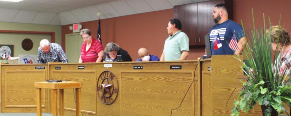 All five council members stood when Mayor Dennis Diggs asked them to identify whether or not they were in favor of removing the executive session from the agenda. HANS LAMMEMAN