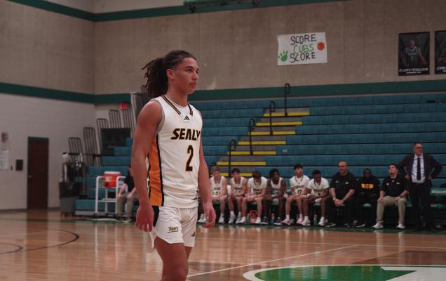 Noah Washington walks up the court during the bi-district victory. PHOTO BY WILSON CHANEY