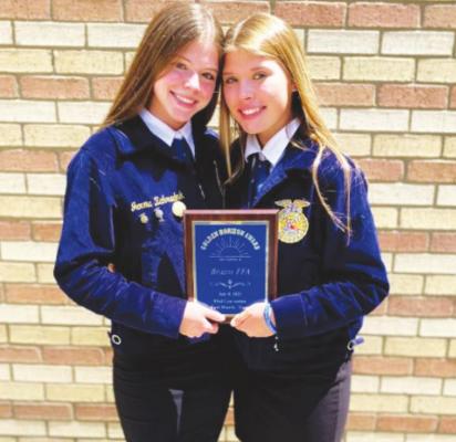 Brazos FFA members Jemma Zahradnik and Paige Demny hold the Golden Horizon award presented to the Texas FFA chapter that exemplifies exceptional character involvement at the State Convention in Fort Worth in early July. CONTRIBUTED PHOTOS