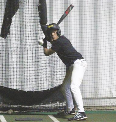 Sealy junior Jose Bludau loads up for a pitch at the team’s first official workout Jan. 22 at Aubrey”Mutr Stuessel Stadium. Bludau helped the Tigers earn their first win of the season Monday night in Columbia. COLE McNANNA