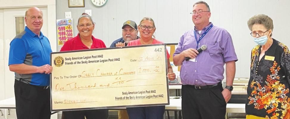 The Fiends of the Sealy American Legion presented a donation to the Sealy Chamber of Commerce during the Bingo Night With the Chamber Aug. 5. Larry Kuciemba, left, and David Littman, second from right, presented the check on behalf of the Friends to the Chamber’s Tammy Hall, Nancy James and Peggy Spradley. PHOTOS BY MISSY THERIOT