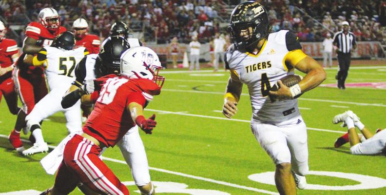 Bellville senior Carson Peschel (19) fights off a block and lunges to make a tackle attempt on Sealy’s Connor Krenek (4) during the rivalry game Oct. 15 at the Pasture of Pain. Peschel was one of five Brahmas to earn academic all-state honors from the THSCA. COLE McNANNA