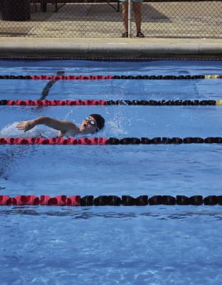 Lilly Flores swims the 50-yard freestyle in 51 seconds at the CATfish Mock Meet.