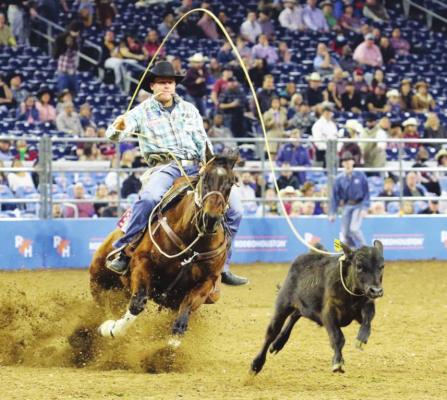 Bellville’s Caleb Smidt competes in the third round of the tie-down roping event in Super Series I at the Houston Livestock Show and Rodeo in NRG Stadium Wednesday, March 2. COURTESY PHOTO