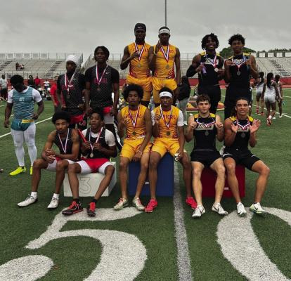 The team of Logan Newsome, Bryce Mack, Noah Washington and Davian Thomas on the podium after coming in 2nd place in the 4x100m relay. COURTESY PHOTO