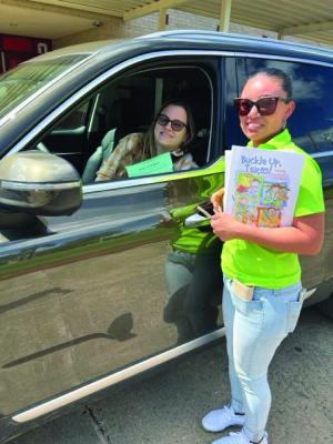 A passenger safety event was held at Bellville Elementary recently. Left to right are Carly Goebel and Maria Alvarez. CONTRIBUTED PHOTO
