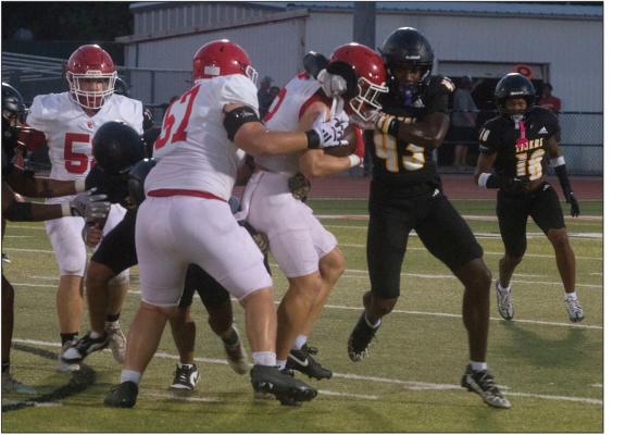 Sealy's defense looks strong in stopping the Columbus offense during last Thursday's scrimmage.