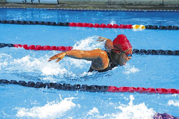 Savana Demers swims in the butterfly stroke event for the 11-12 age group for the CATfish. SEALY NEWS | EVAN HALE