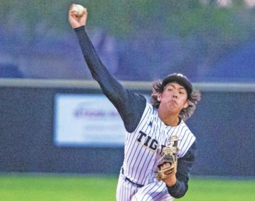 Sealy senior Jose Bludau fires a pitch during the Tigers’ home district game against Wharton last Friday. COLE McNANNA
