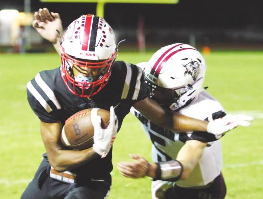 Brazos athlete Bryson Bennett attempts to fight off an East Bernard defender during the Cougars’ district game against the Brahmas Oct. 1, 2020, at Cougar Stadium in Wallis. Bennett is one of 14 returning starters heading into the 2021 season. FILE PHOTO