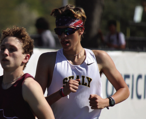 Samuel Eschenburg tries to pass a runner during the 3200m race. SEALY NEWS | EVAN HALE