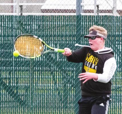 Hayden Havel connects on a hit during a singles match at the Tigers’ host quad match in Sealy Feb. 16. COLE McNANNA