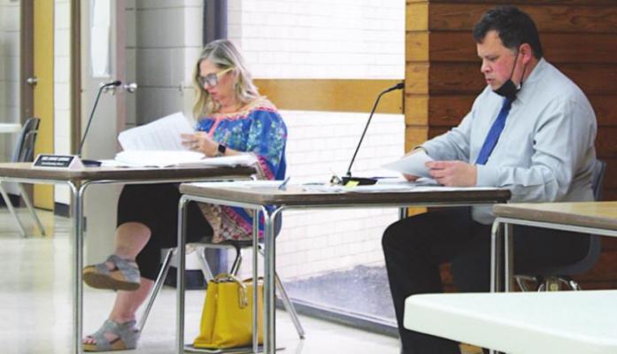 Sealy City Councilmember Dee Anne Lerma and Interim City Manager Warren Escovy prepare for the March 30 regular meeting at the W.E. Hill Community Center. Escovy made a presentation at the most recent meeting regarding gas utility payments. KAREN LOPEZ