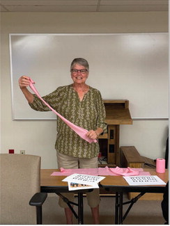 Shirley Beum leads a program on chair yoga for EEA members.