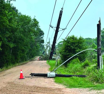 All throughout the Raccoon Bend area, power lines can be found down along streets and houses as residents in the area had to endure the hot weather without electricity for the past week. COURTESY PHOTO