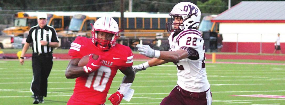 Bellville senior running back Richard Reese looks to bend around a Cameron defender during the Brahmas’ non-district contest against the Yoemen last Friday at the Pasture of Pain. Reese provided three touchdowns to help lift the hosts. COLE McNANNA