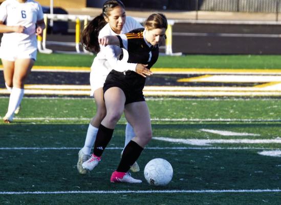 Avery Schalla battles through a defender to get possession of the ball. COURTESY PHOTO