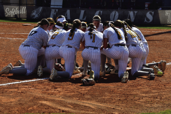 The Sealy Lady Tigers say a quick team prayer before the game. COURTESY PHOTO