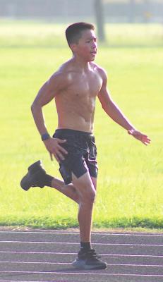 Fernando Garza finished his first day of practice with a sprint workout on the track of the practice field at Sealy High School Monday morning. PHOTOS BY COLE McNANNA
