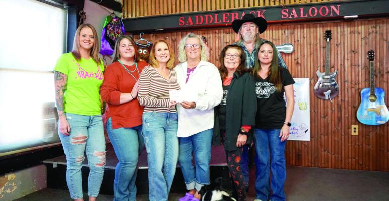 The Bras for a Cause check presentation to The Blessing Box was made recently at Saddleback Saloon. The event raised more than $7K for The Blessing Box project and continues to raise much needed attention to breast cancer awareness. PHOTO BY WILSON CHANEY