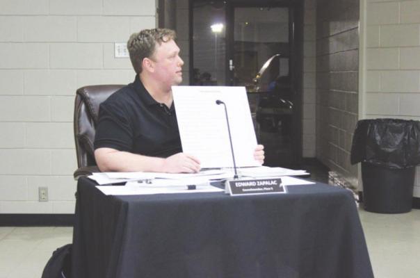 Councilmember Edward Zapalac displayed items that went unfunded in an effort to demonstrate the severity of the council’s decisions on the budget. HANS LAMMEMAN