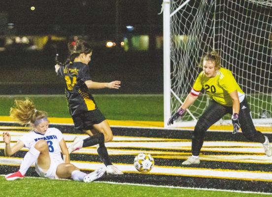 Sealy freshman Dominique Castillo looks to fire a shot in close to the Navasota net in the first half of the Lady Tigers’ district match last Friday at home against the Lady Rattlers. COLE McNANNA
