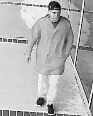 The FBI Violent Crime Task Force seeks the public’s help to identify and locate a bank robber dubbed the “Little Red Riding Crook” who struck a Houston bank wearing a red raincoat-style jacket. CONTRIBUTED PHOTOS