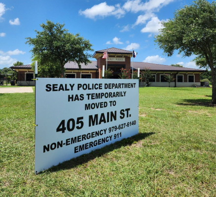 A sign announcing the temporary move of the Sealy Police Department sits outside its building. COURTESY OF SEALY PD FACEBOOK