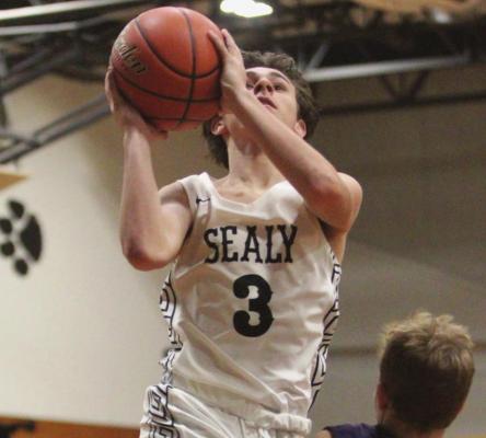 Sealy’s Ryder Ramirez goes up for a contested basket during the Tigers’ season-opening contest against La Grange Nov. 26, 2019, at the junior high. Ramirez twice led his team in points during last week’s play. COLE McNANNA