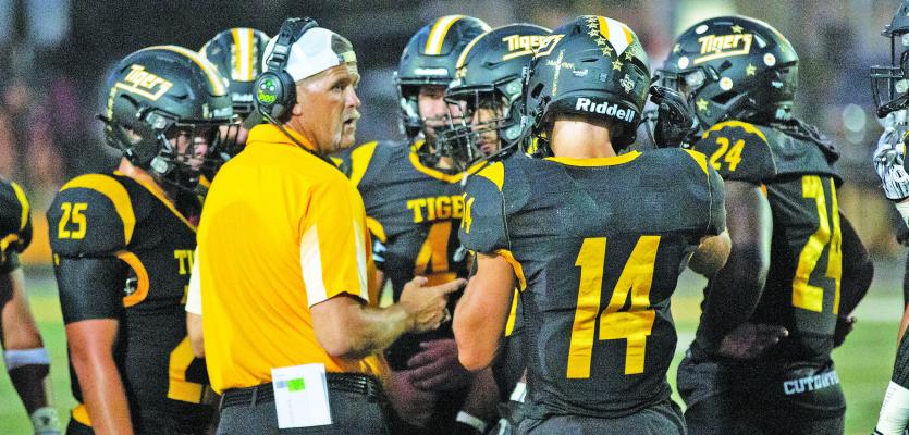 Sealy Head Football Coach Shane Mobley talks with his defensive squad during a recent district contest. Sealy will take on Bellville Friday night at T.J. Mills Stadium at 7 p.m. PHOTO BY JIMMY GALVAN