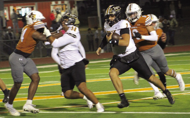 Sealy quarterback Kane Killough, 7, follows the blocking of Ryland Ponce, 58, during Friday night’s football action in Caldwell. Sealy defeated the Hornets 72-12 in an important district game.
