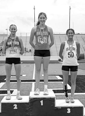Sophia Vykukal, center, won first place at the regional meet in the long jump and now is headed to the state meet. COURTESY PHOTO