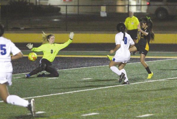 Sealy freshman Rebeca Garza puts home a rebound that gave the Lady Tigers a 3-0 lead in the second half to sweep Rice Consolidated Monday at T.J. Mills Stadium. It was Garza’s second goal of the night. COLE McNANNA