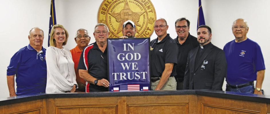 Knights present posters to Sealy ISD
