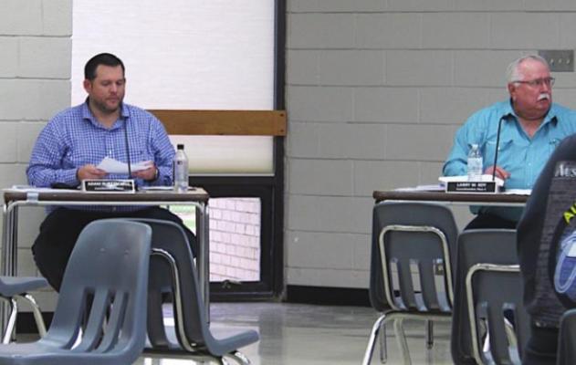 Sealy City Councilmembers Adam Burttschell and Larry Koy prepare for the March 30 joint meeting of the city council and planning commission at the Hill Center. KAREN LOPEZ
