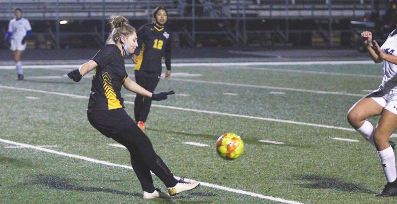 Sealy senior Dania Picasso clears a ball during a non-district game against Needville last Monday at T.J. Mills Stadium. PHOTOS BY COLE MCNANNA