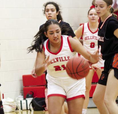 Diana Romero snatches up a loose ball during a game against Smithville.