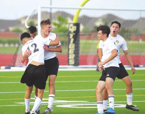 Sealy sophomore Tanner Ellis (10) celebrates the game-opening score with teammates Amador Lopez (12), Rodolpho Olivarez (3) and Ricky Avila (far right) during the Tigers’ regional semifinal playoff game against Splendora April 6 at Cy Park High School. Ellis was one of Sealy’s four second-team all-district honorees.