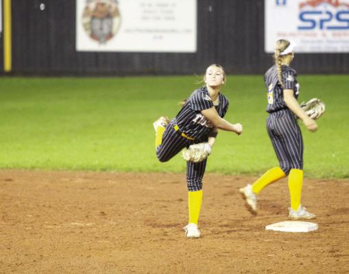 Ava Carr throws a runner out at first after scooping a ground ball.