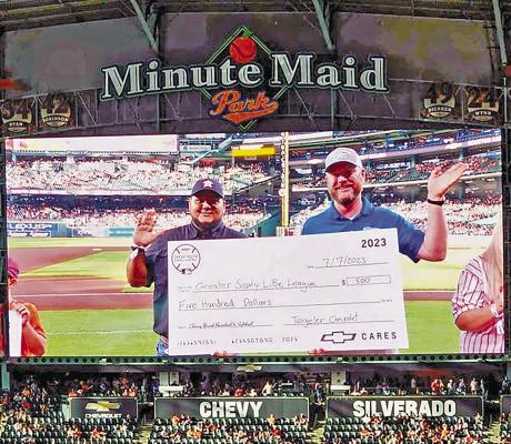 At a recent Houston Astros game, Tegeler Chevrolet of Sealy, through the Chevy Youth Baseball &amp; Softball Program, presented a check and equipment to the Greater Sealy Little League. Pictured are the GSLL’s Director of Sponsorships, Greg Hluchan, and Brad Tegeler. CONTRIBUTED PHOTO