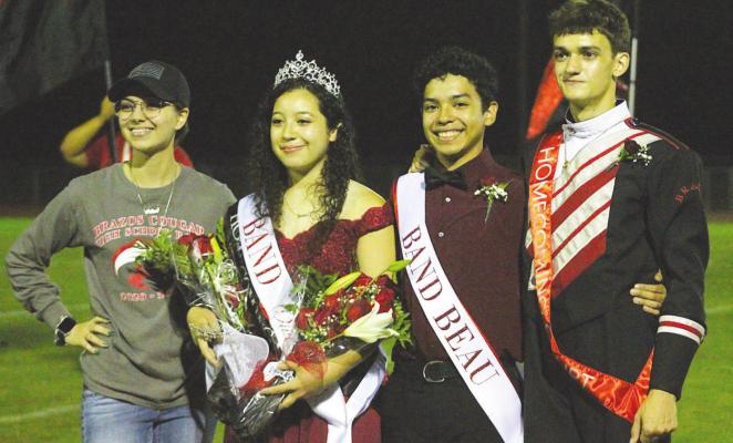 Joanna Ramos and Joshua Martinez (center two) won the Brazos Band Beau and Sweetheart as voted on by their peers and were honored during the halftime celebration at Cougar Stadium in Wallis last Friday night. PHOTOS BY COLE McNANNA