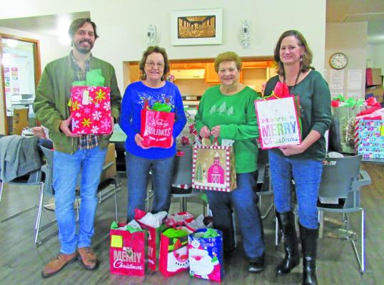 Frydek Catholic Daughters, Court Our Lady of Faith #2607, sends Christmas greetings and gifts to the 95 Residents of the Silver Lake and The Oaks Retirement Community in Sealy. Pictured L-R are Andrew Tirey, Manager; Regent Cathy Ondruch, Treasurer Doris Sodolak and Member Theresa Young. SUBMITTED PHOTO