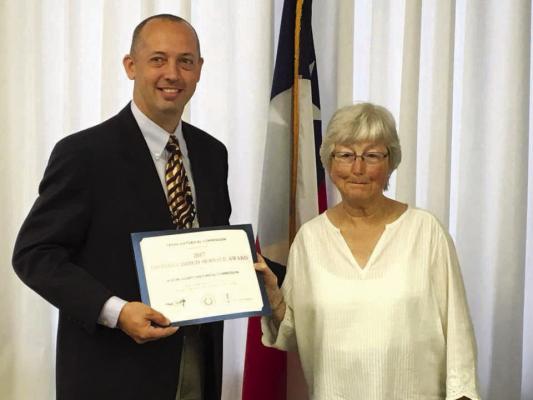 Grace Holtkamp accepted the 2018 Distinguished Service Award on behalf of the Austin County Historical Commission this morning at Austin County Commissioners Court. SEALY NEWS FILE PHOTO