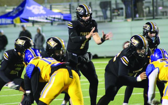 Sealy quarterback Kane Killough takes a snap from center during last Friday’s playoff game with La Vega. Sealy lost the contest and was eliminated from the Class 4A playoffs. PHOTO BY WILSON CHANEY
