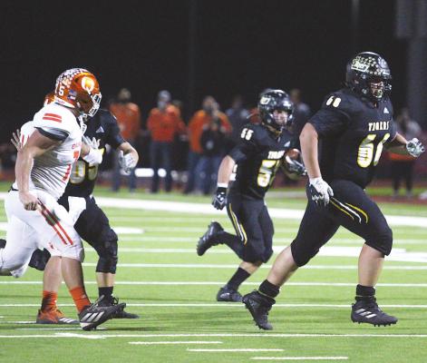 Sealy senior Kade Killough (68) looks to make a block for Jackson Osborne (55) on his 11-yard gain in the bi-district playoff game against the Orangefield Bobcats at Huffman’s Falcon Stadium on Nov. 12. Osborne earned first-team academic all-state distinction and Killough garnered an honorable mention. Photos by Cole McNanna