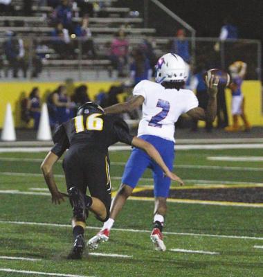 Tiger senior Rhys Reichardt (16) pursues Wharton quarterback Sterling Harris in Sealy’s district showdown at T.J. Mills Stadium on Oct. 30. Reichardt represented the Tigers on the first-team academic all-state presented by the THSCA and Texas Army National Guard.