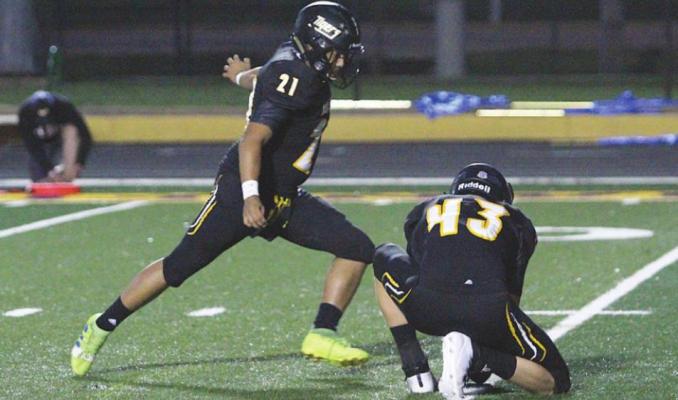 Sealy senior classmates Blake Zaskoda (43) and Joshua Paz (21) provided key kicks including this extra point in the Tigers’ non-district battle at T.J. Mills Stadium against the Bay City Blackcats on Sept. 25. Zaskoda earned second-team academic all-state recognition and Paz garnered an honorable mention.