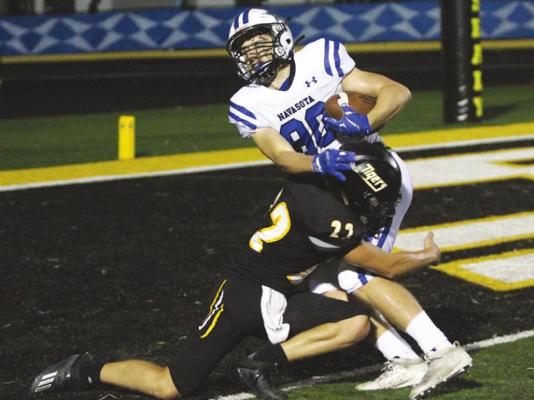 Tiger senior Grayson Brandes (22) collides with Navasota receiver Liam Wilson (80) at the goal line during the non-district contest at T.J. Mills Stadium on Sept. 4. Brandes was one of five Sealy student-athletes to earn academic all-state honorable mention.