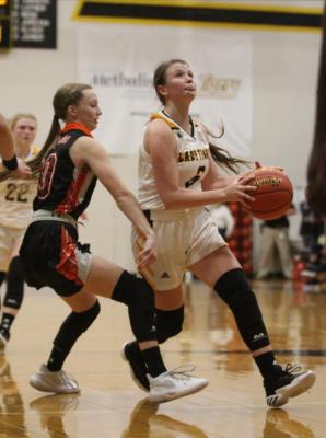 Lady Tiger senior Brylie Bond drives the lane in a non-district contest against Gonzales at home on Dec. 7, 2020. At the end of non-district play, Bond had a team second-best scoring average at 8.2 points per game.