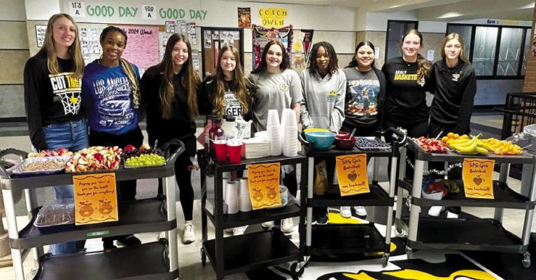 The SHS Girls varsity basketball team hosted “Fun Cart Friday” Friday, Jan. 19 for the teachers featuring a fresh fruit bar. Pictured left to right are Grace Eschenburg, Savannah Hill, Blair Kram, Kara Kram, Hannah Diemer, Taniah Coleman, Estrella Alvarez, Addison Clark and Sydney Petrash. COURTESY PHOTOS